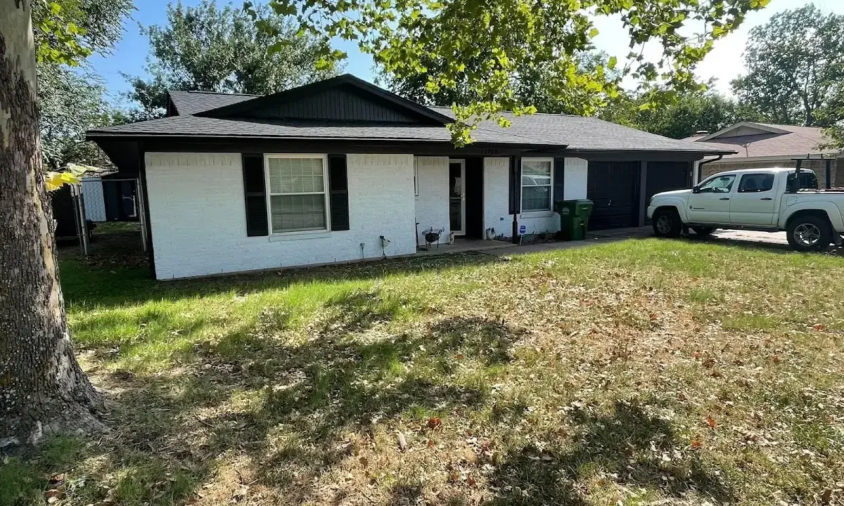 Professional roofing crew working on a residential roof in Southchase